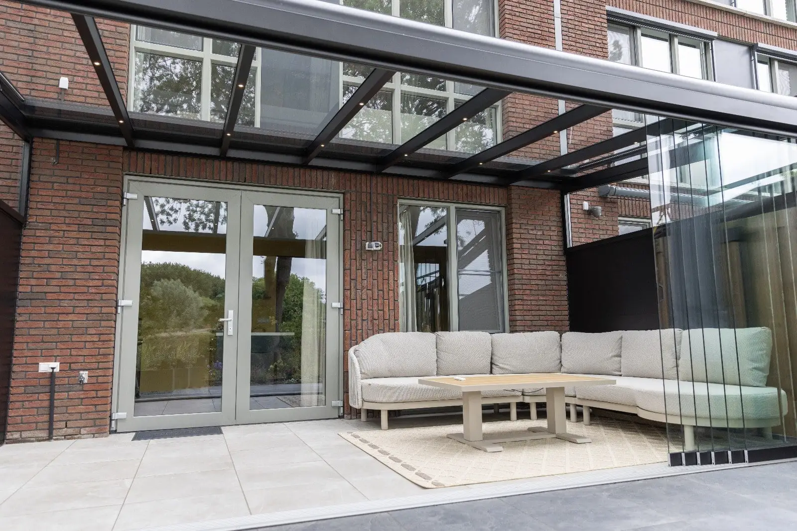Contemporary Kedington glass veranda with slim aluminium frame and glass roof — part of Saffron Outdoor Living’s range of verandas in Essex, Suffolk, and Cambridgeshire.