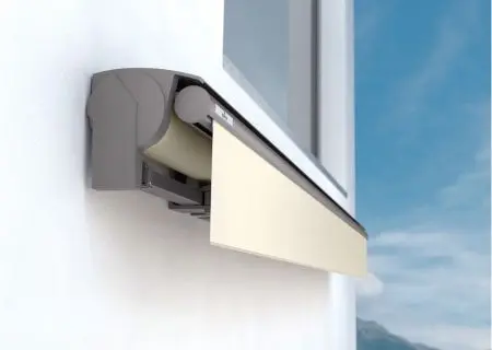 Partially extended Weinor Topas awning in ivory, mounted beneath a window on a white wall.