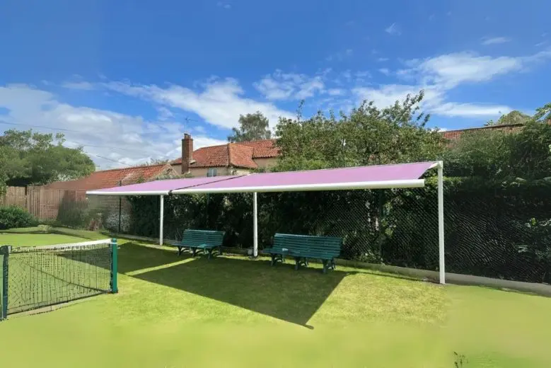 Wide view of Weinor awnings installed by Saffron Outdoor Living at South Creake Tennis Club.