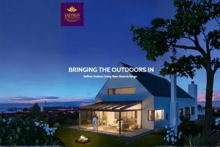 Saffron Outdoor Living veranda brochure cover showing illuminated glass veranda at dusk